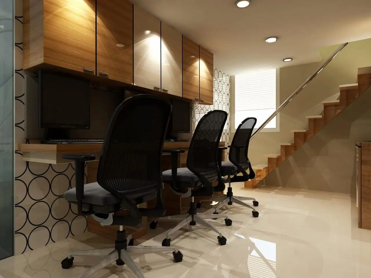 Workstations with black mesh chairs and wood-finish overhead storage beside a staircase